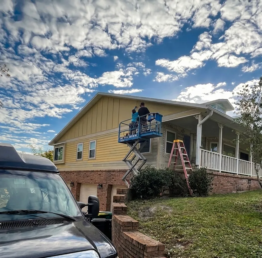 CCA crew installing Hardie Board fiber cement siding on a Brevard County Florida home